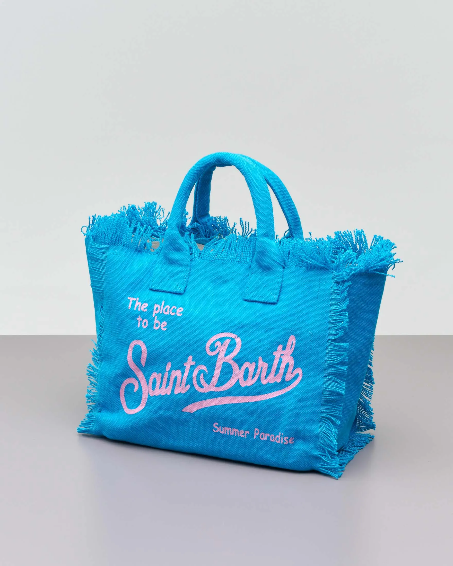 Borsa Colette turchese in cotone con logo rosa e orli sfrangiati