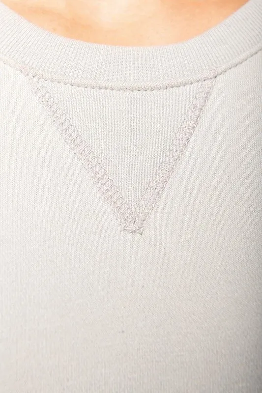 Felpa girocollo in cotone biologico con maniche raglan