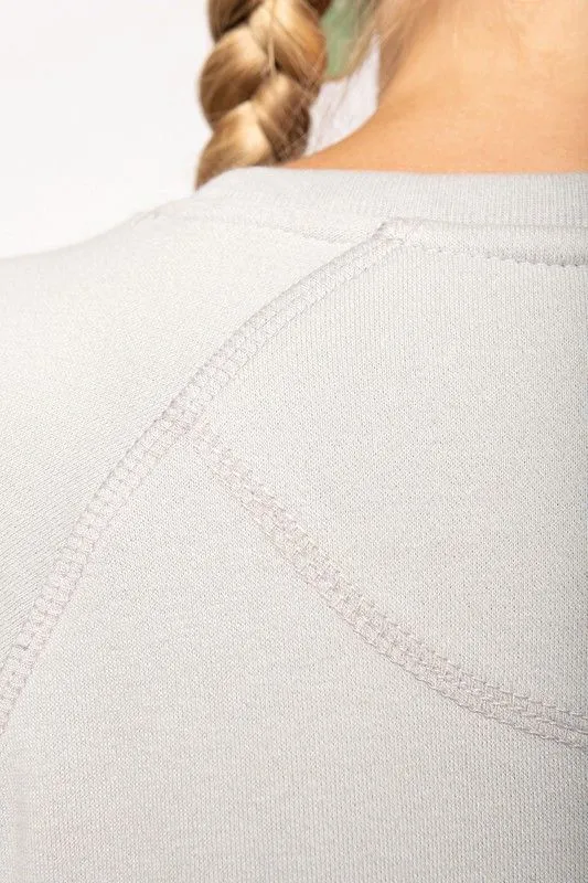 Felpa girocollo in cotone biologico con maniche raglan